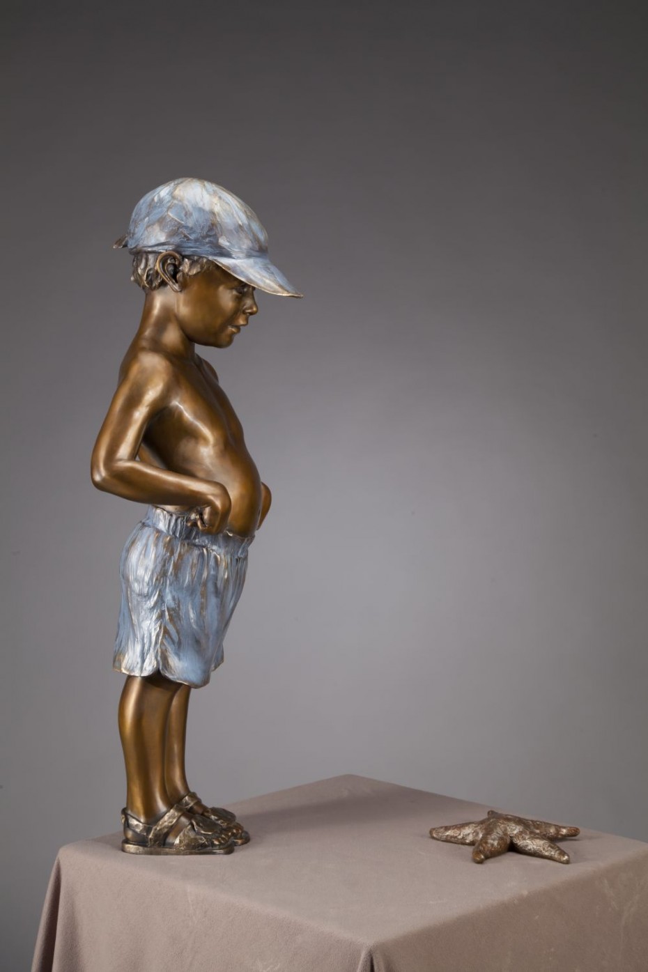 Starstruck child bronze sculpture with starfish
