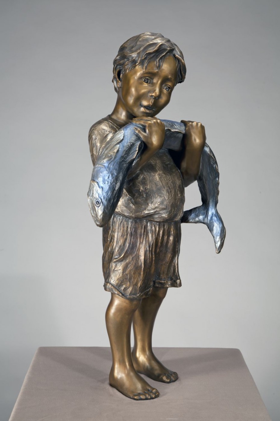Holy Mackerel Boy in Bronze with Fish